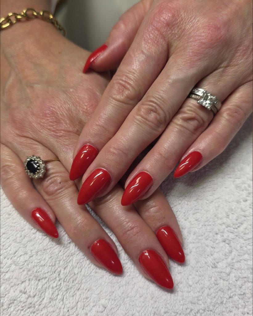 Glossy red almond nails, freshly finished